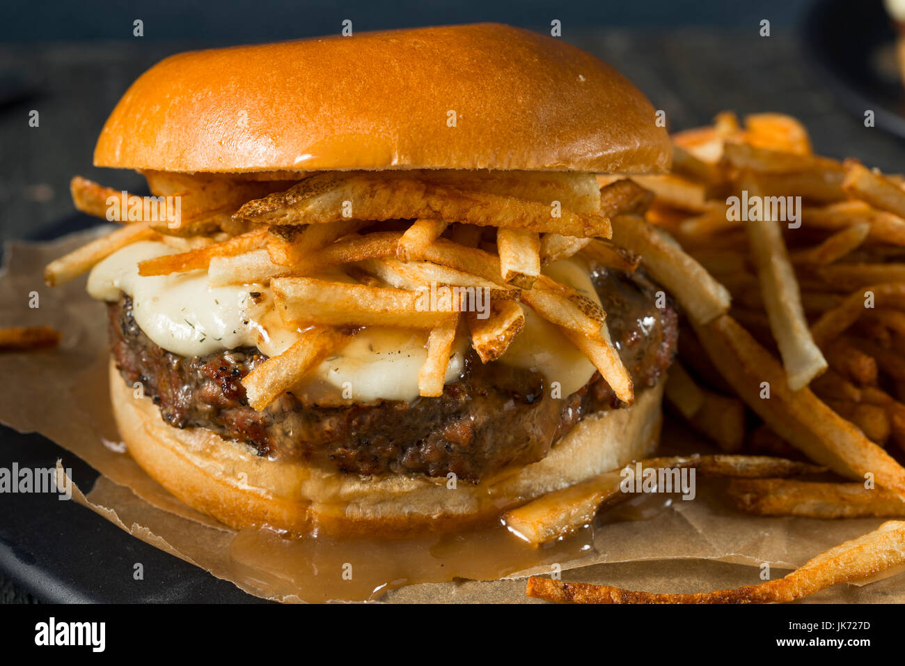 Homemade Poutine Hamburger with Fries Gravy and Cheese Curds Stock