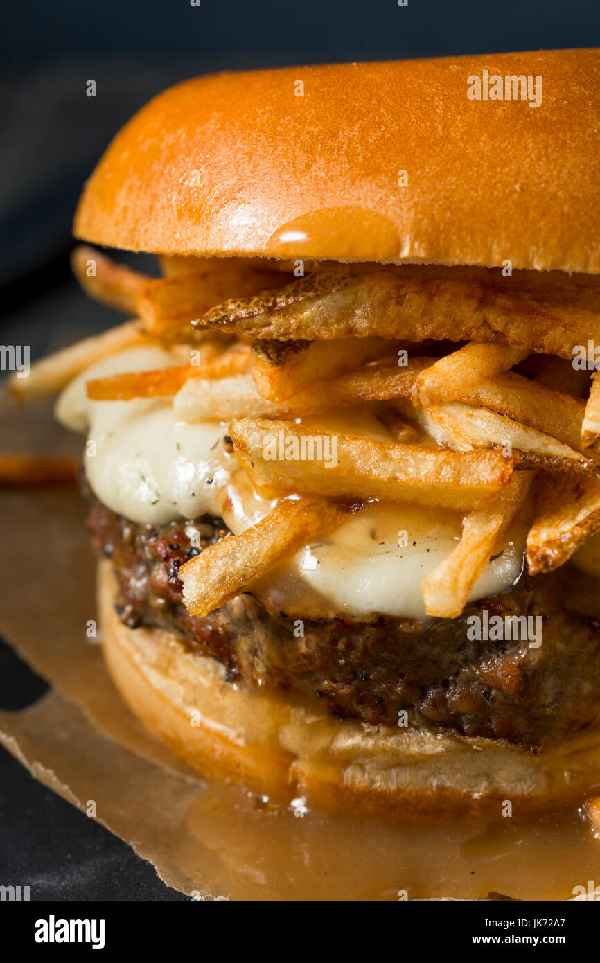 Homemade Poutine Hamburger with Fries Gravy and Cheese Curds Stock