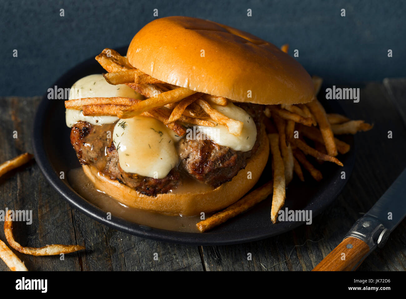 Homemade Poutine Hamburger with Fries Gravy and Cheese Curds Stock