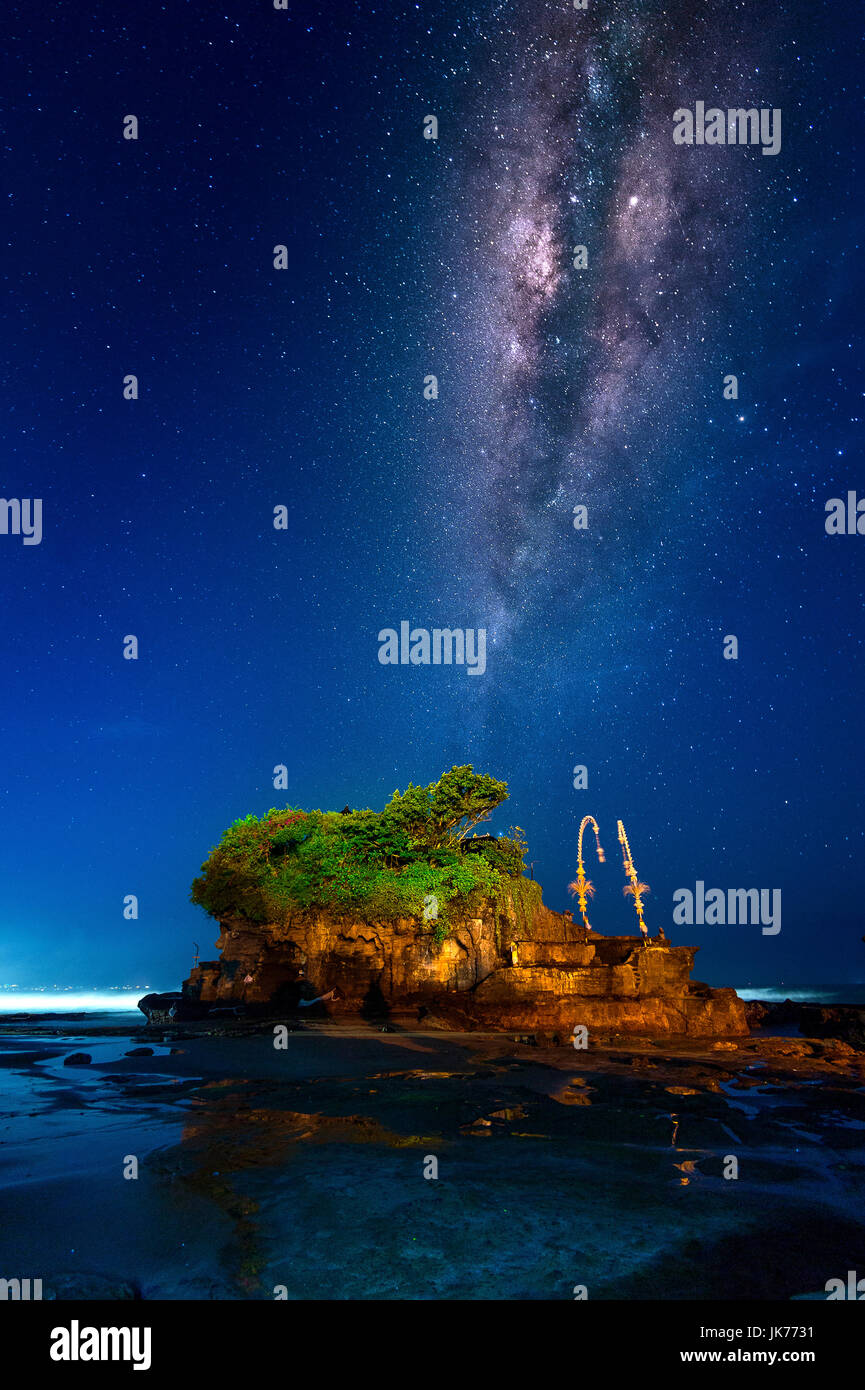 Milky way over Tanah Lot Temple at night in Bali, Indonesia.(Dark) Stock Photo