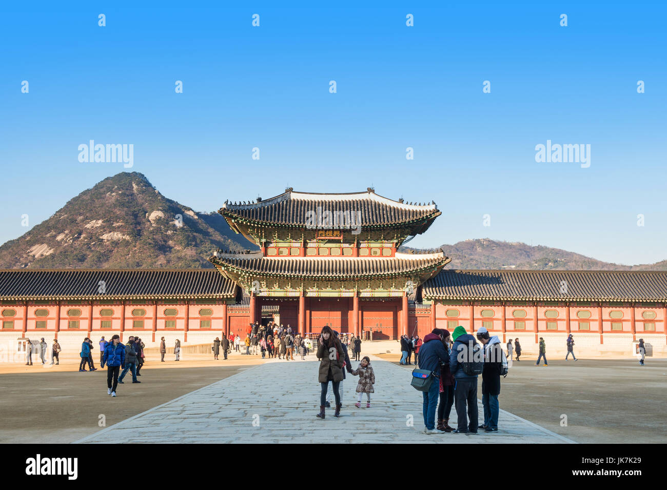 SEOUL, SOUTH KOREA - JANUARY 17: Tourists taking photos of the beautiful scenery around Gyeongbokgung Palace on January 17, 2015 in Seoul, South Korea Stock Photo