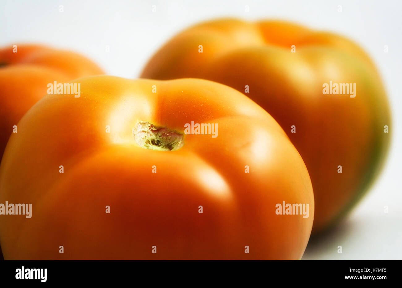 Group of ripe tomatoes isolated on white background Stock Photo - Alamy