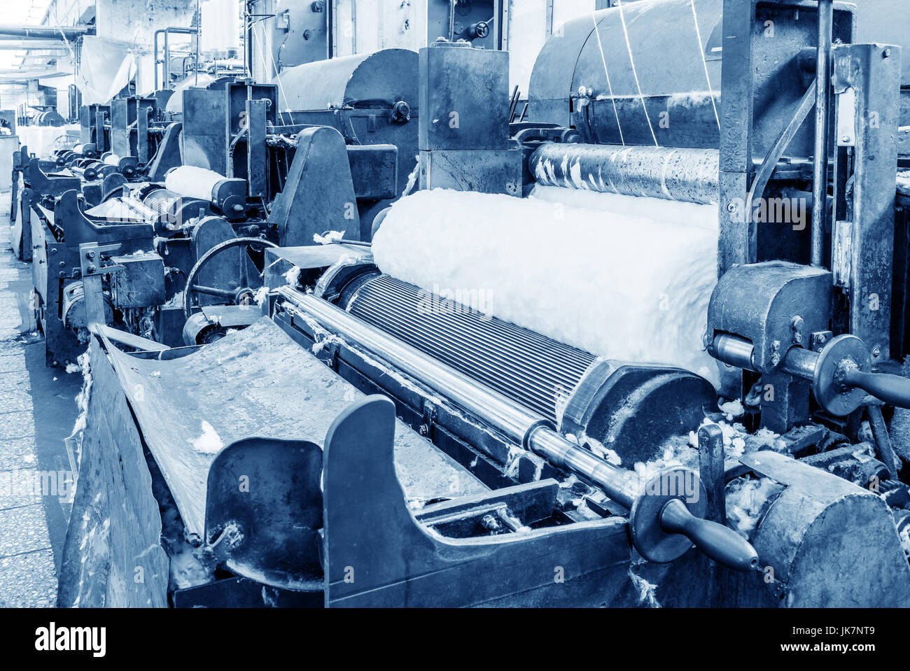 Features of carding machine in textile mill Stock Photo Alamy