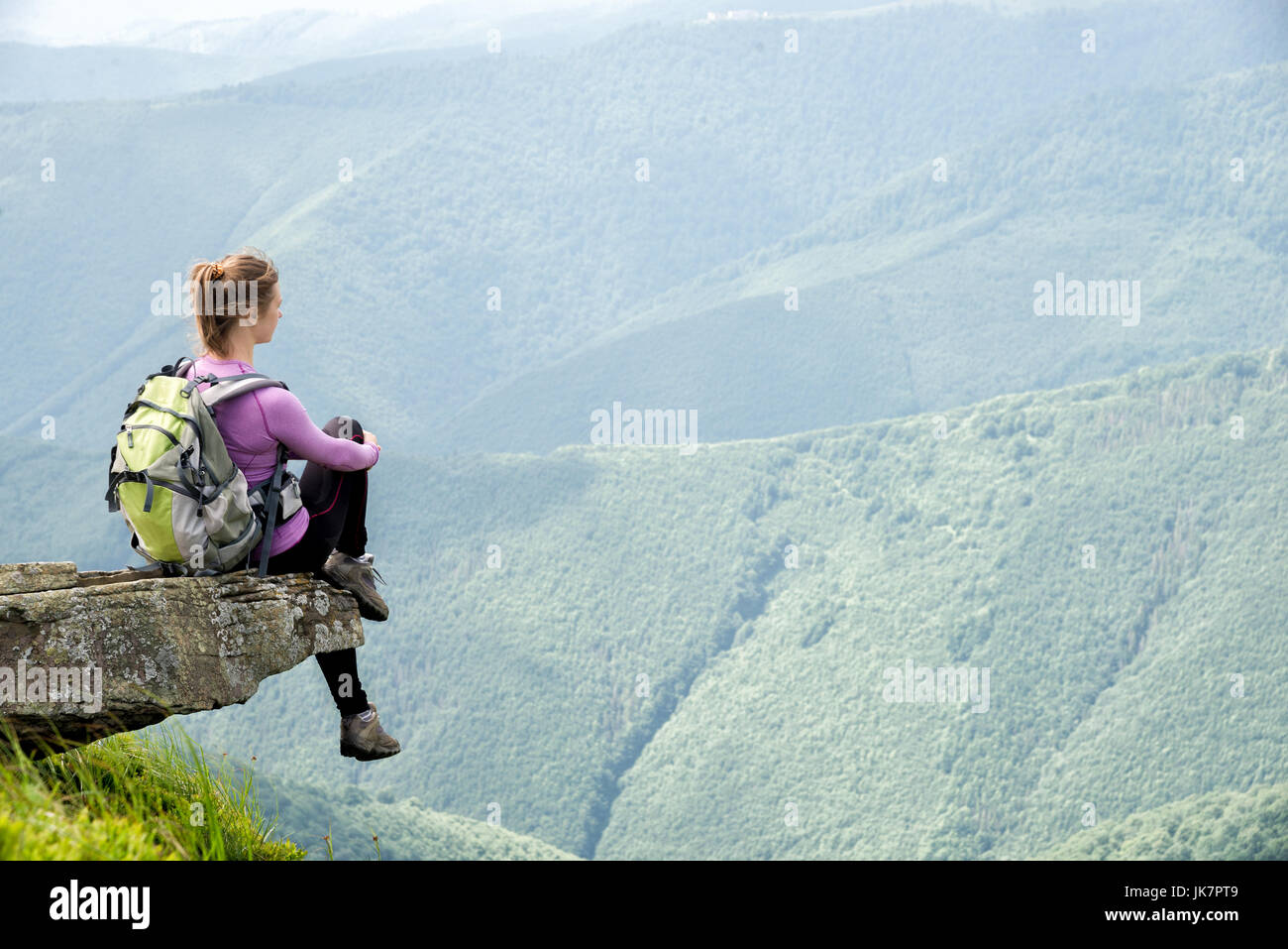 Young woman hiking in the mountains Stock Photo - Alamy