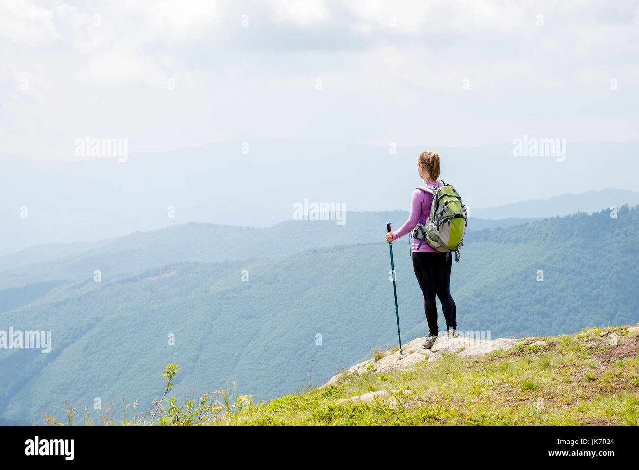 Young woman hiking in the mountains Stock Photo - Alamy