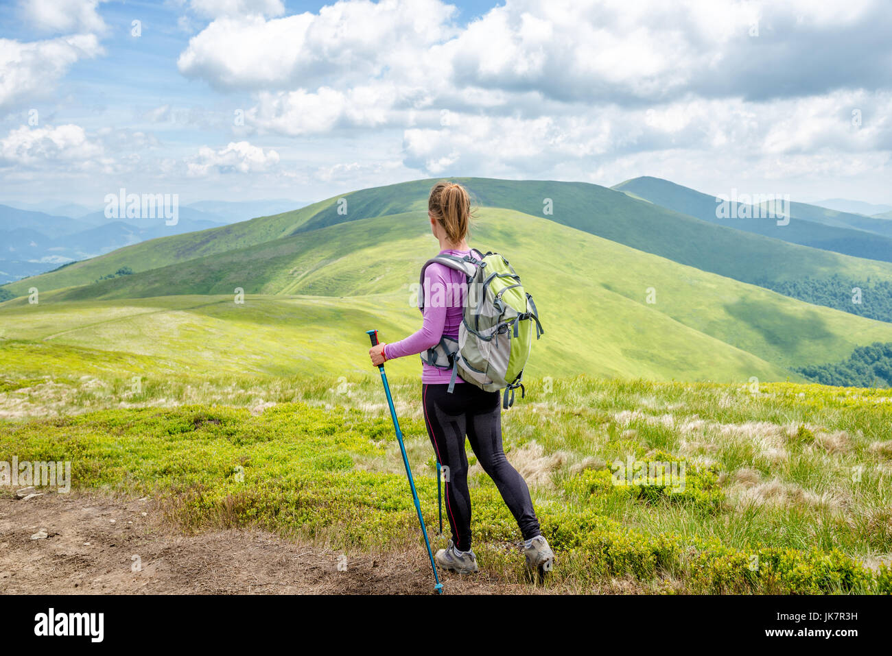 Young woman hiking in the mountains Stock Photo - Alamy