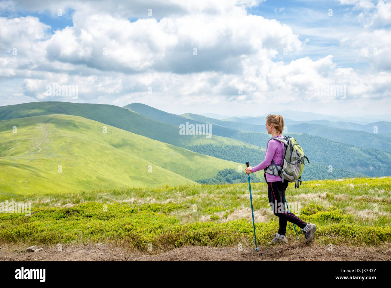 Young woman hiking in the mountains Stock Photo - Alamy