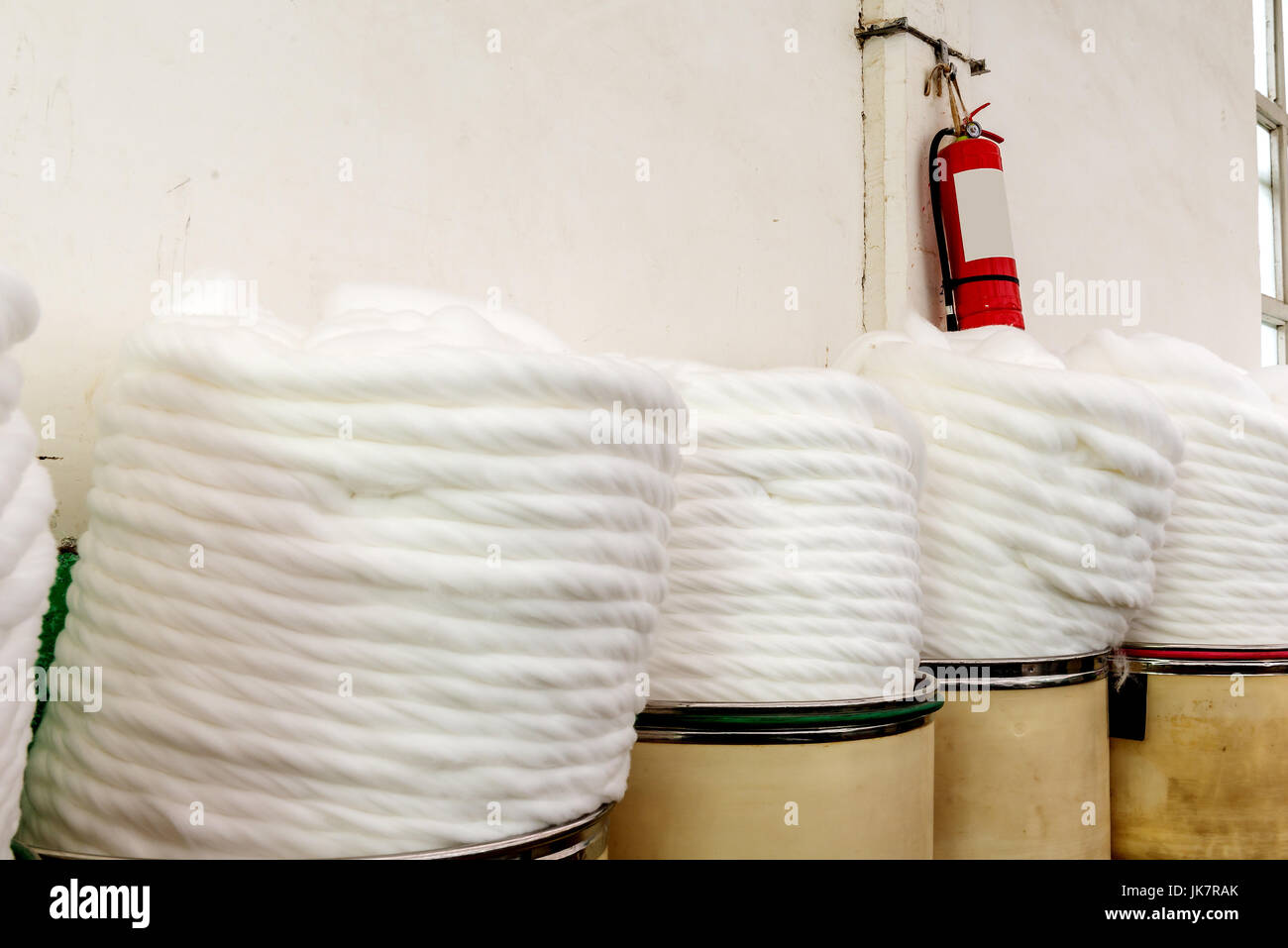 cotton group closeup in spinning production line factory Stock Photo