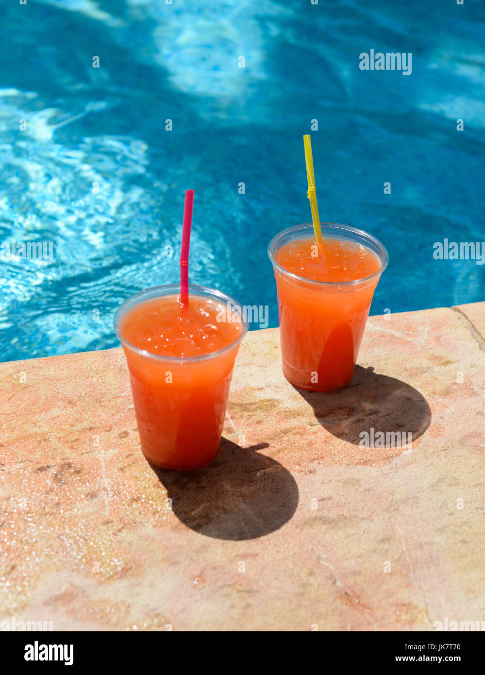 Pool Coctails tropical coctails an a pool side Stock Photo - Alamy