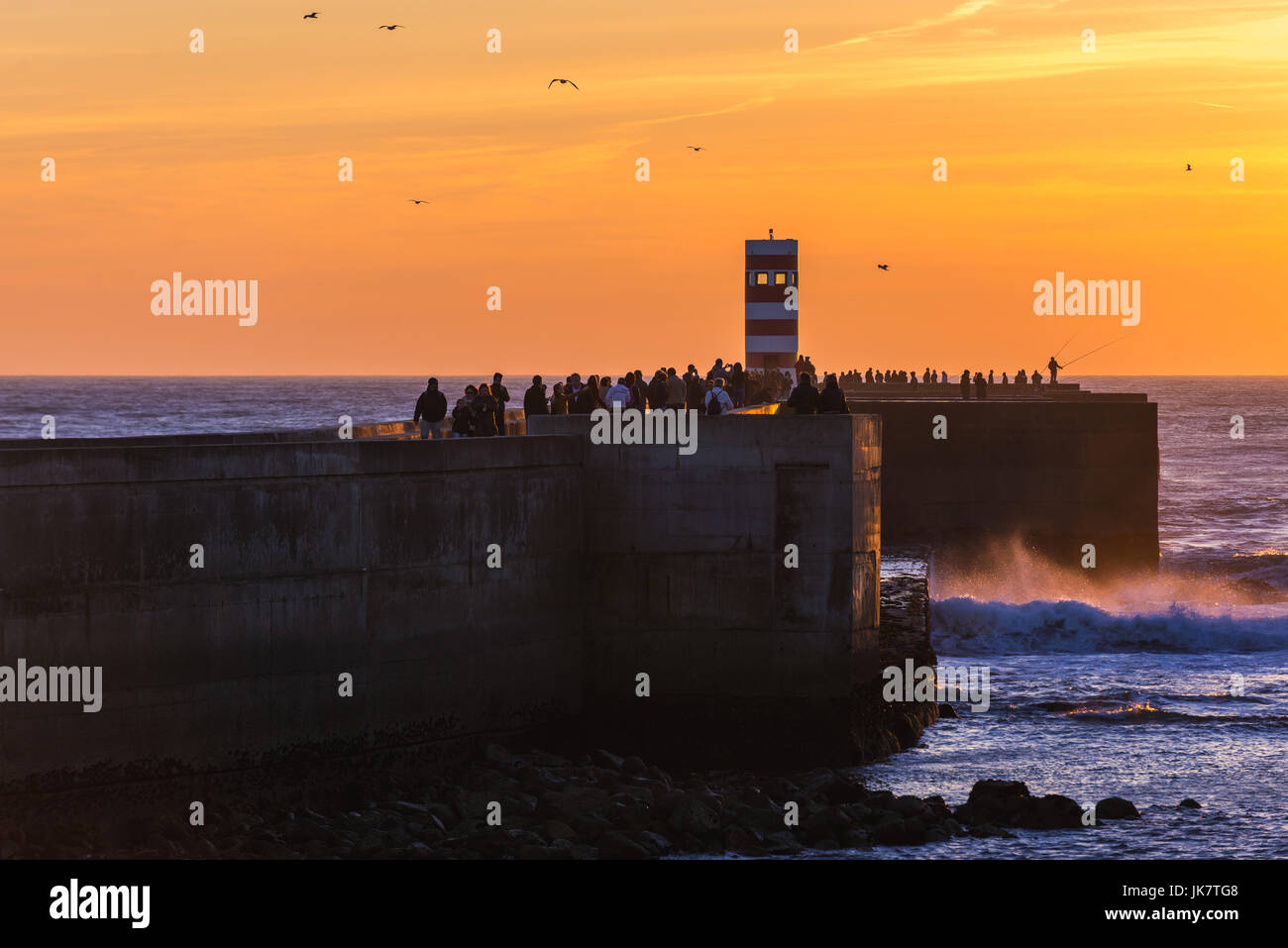 Sunset over Farolins da Barra do Douro small lighthouse in Foz do Douro district of Porto city, second largest city in Portugal Stock Photo