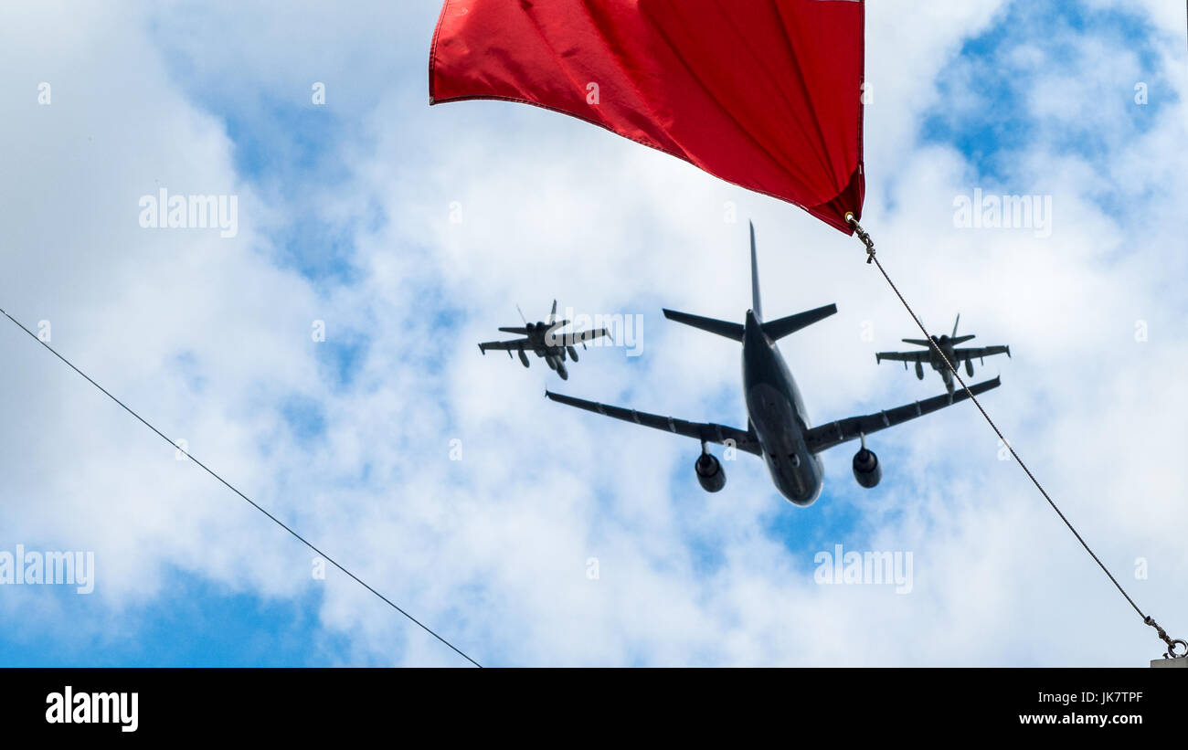 Airbus CC-150 Polaris and McDonnell Douglas CF-18 Hornet of Royal Canadian Air Force fly under the Canada Flag, Ottawa, Canada Day (July 1) Stock Photo