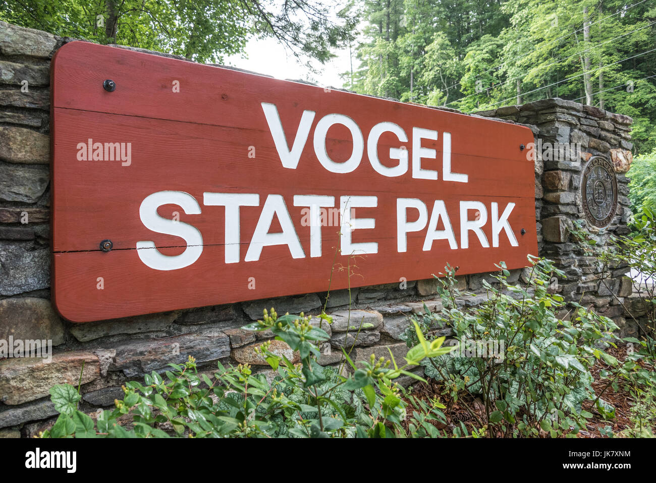 Wood and stone entrance sign for Vogel State Park, a popular Georgia State Park nestled in a high elevation valley of the Blue Ridge Mountains. Stock Photo