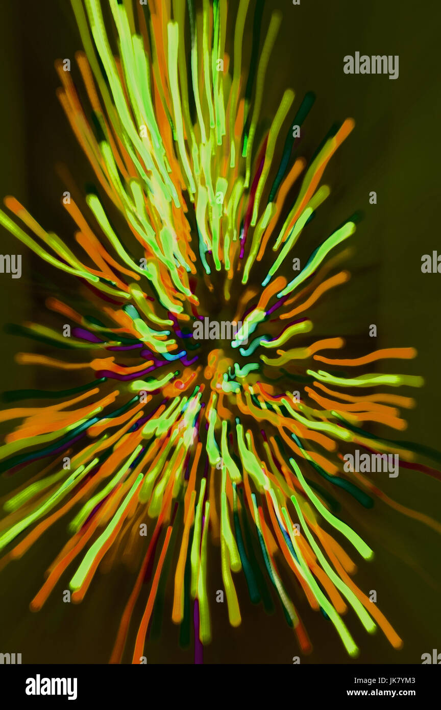 explosion of lights, taken by zooming in on a Christmas Tree, then changing color on Photoshop Stock Photo