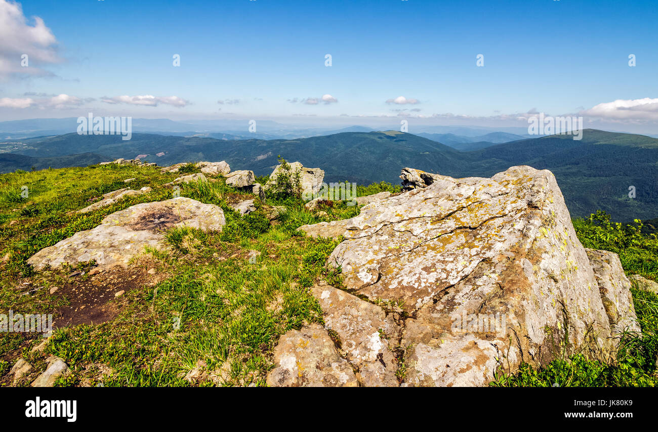 huge boulders on the edge of hillside. fine weather in summer mountain landscape Stock Photo