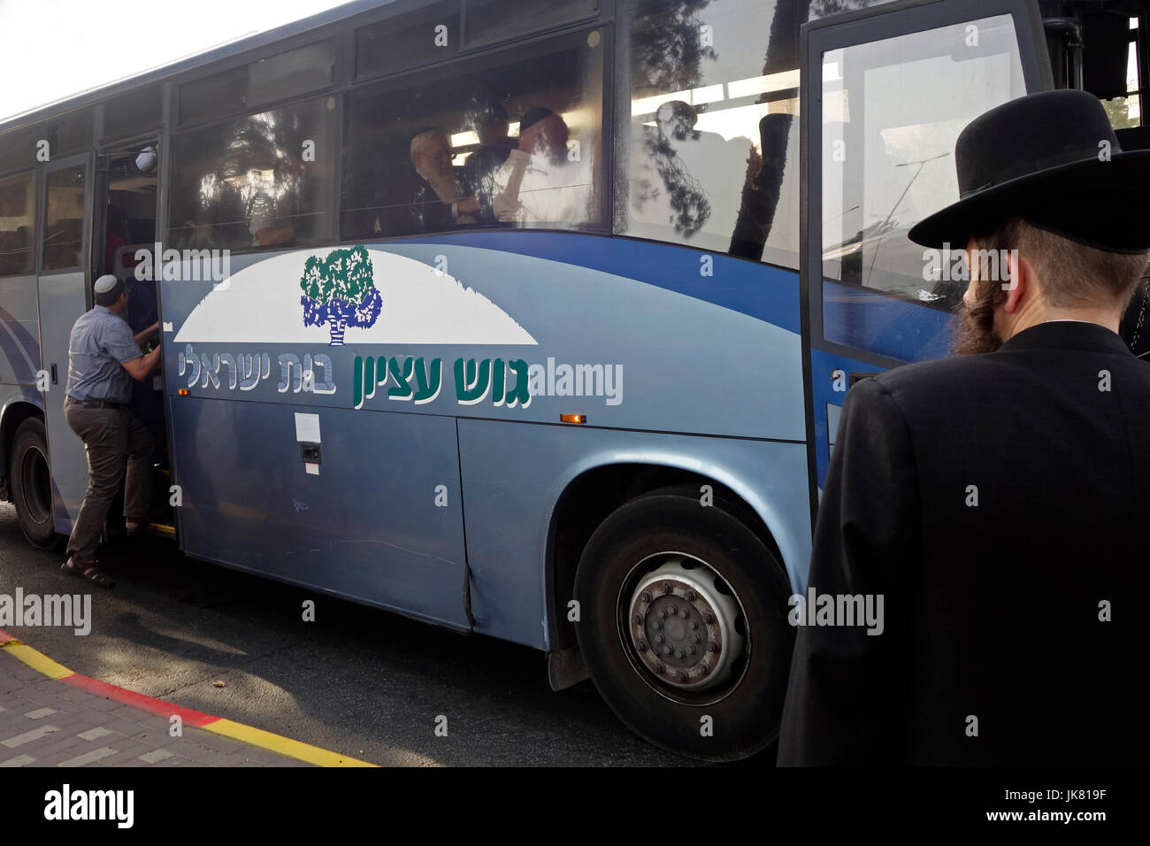 Jewish settlers boarding a bus in Jerusalem on its way to Gush Etzion a cluster of Jewish settlements located in the Judaean or Judean Mountains, in the West Bank. Israel Stock Photo