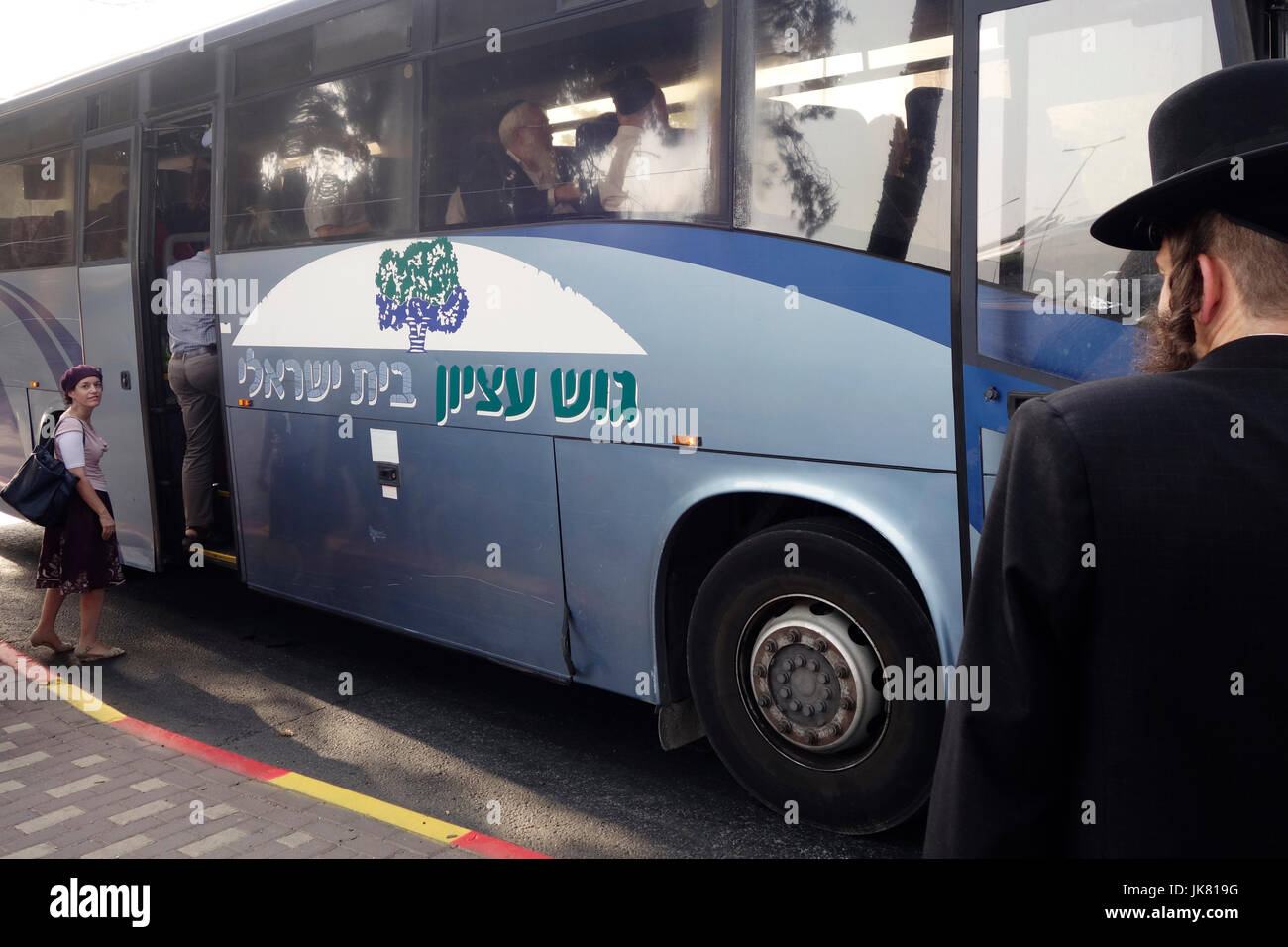 Jewish settlers boarding a bus in Jerusalem on its way to Gush Etzion a cluster of Jewish settlements located in the Judaean or Judean Mountains, in the West Bank. Israel Stock Photo