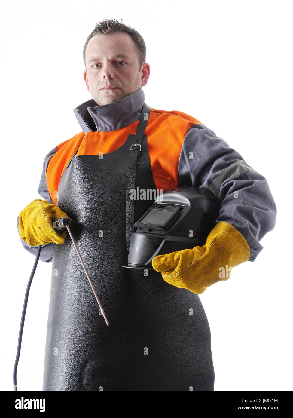 Portrait of welder wearing protective welding black leather apron, welding hood and welding electrode holder over white Stock Photo