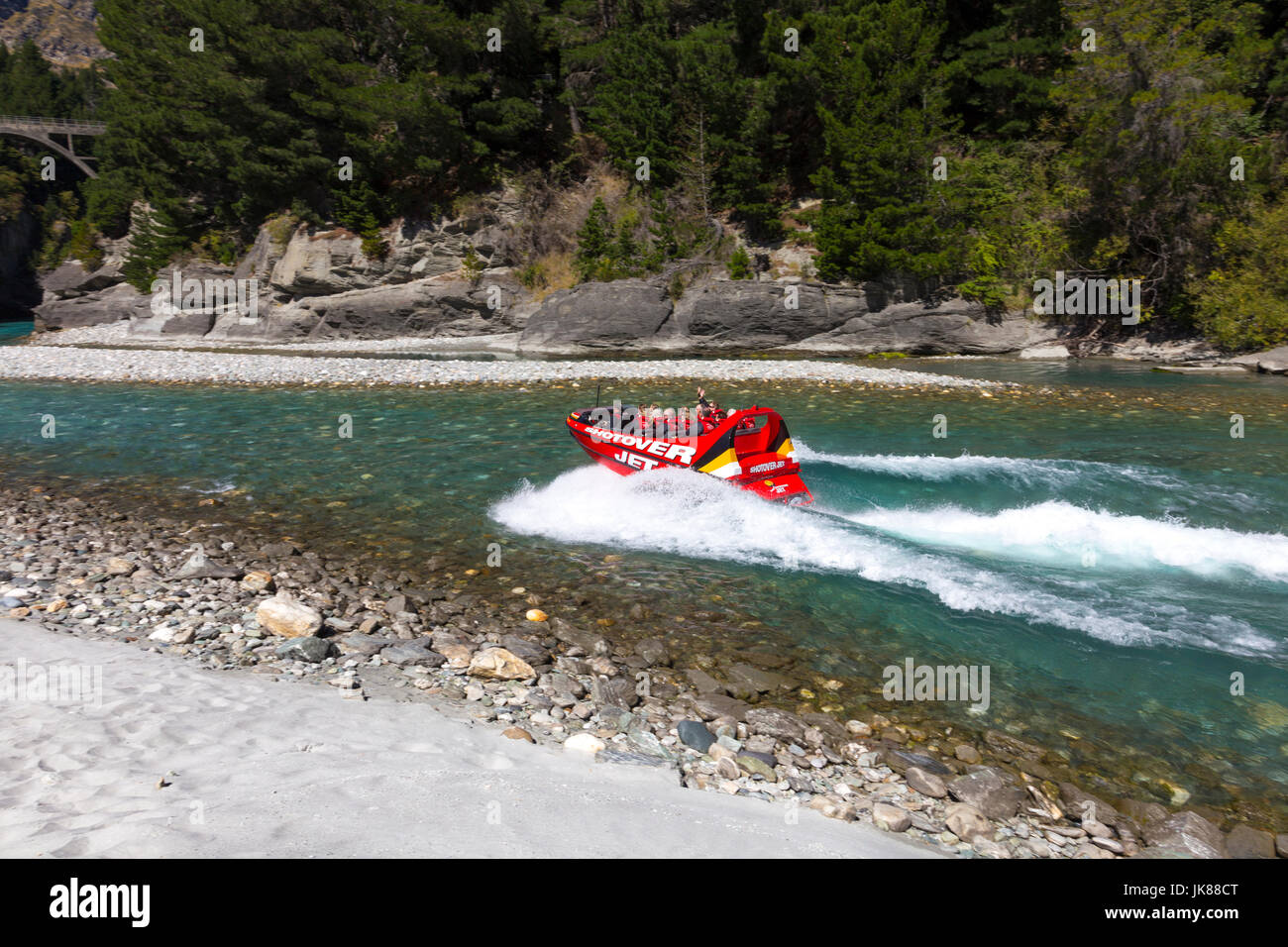 Tourists riding the Shotover jet in the Shotover River Canyon in Queenstown, New Zealand Stock Photo