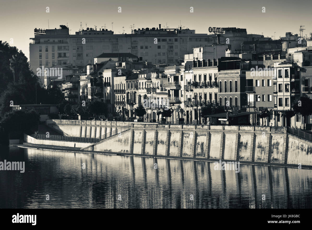 Spain, Andalucia Region, Seville Province, Seville, Waterfront view along the Rio Guadalquivir River of the Triana area, dawn Stock Photo