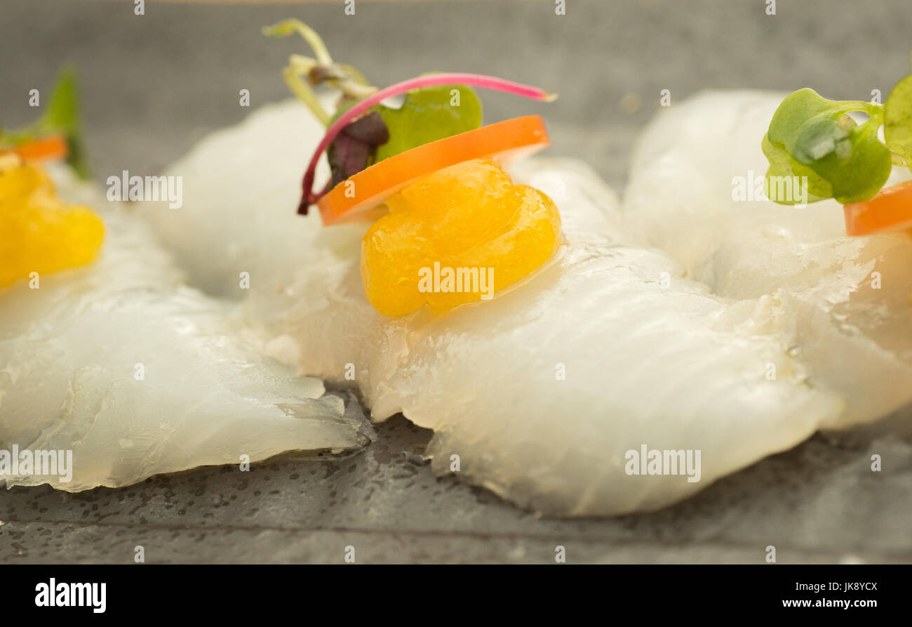 Elegant and colorful halibut sushi on plate, ready to eat Stock Photo