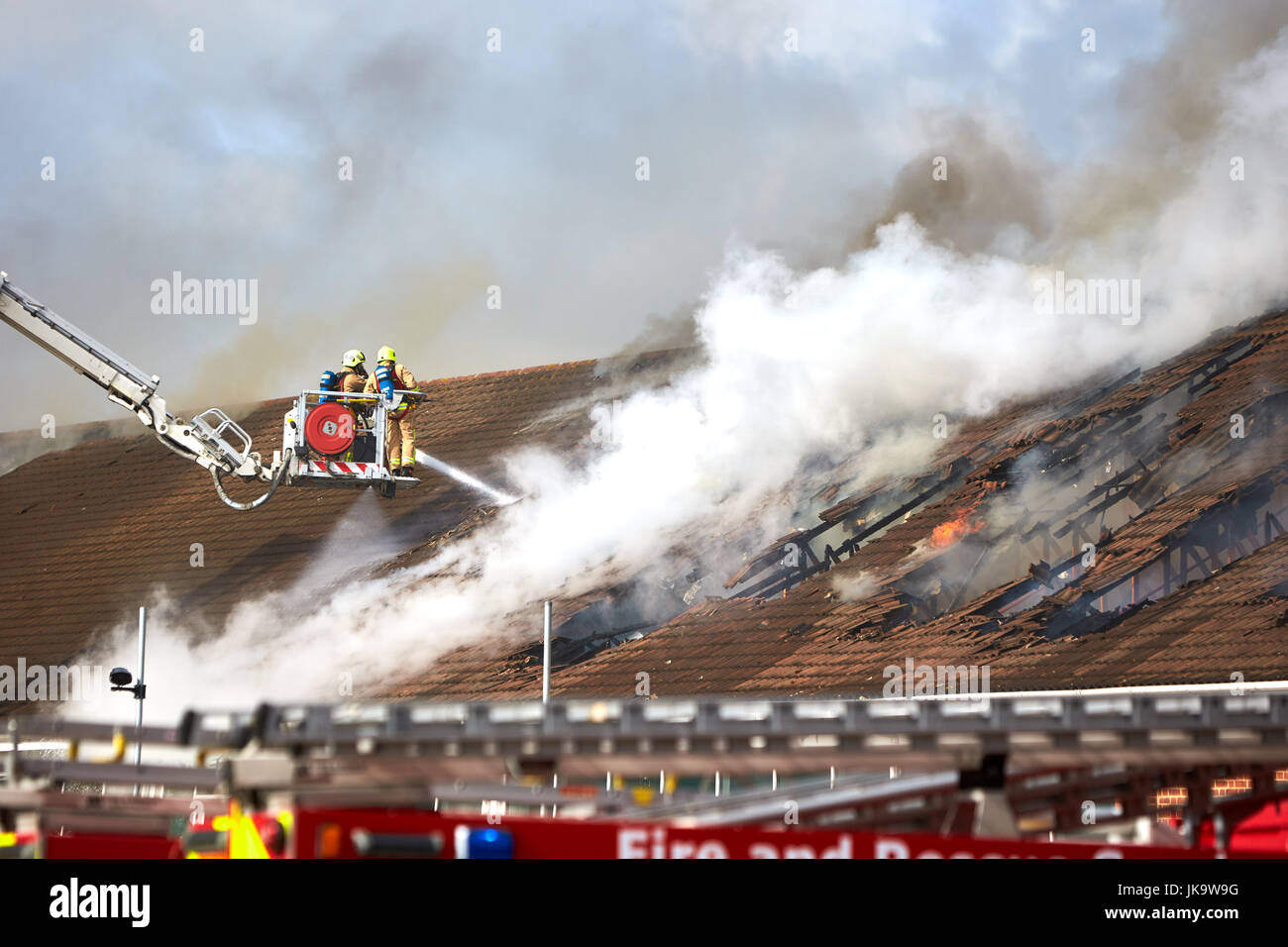 Firefighters tackle a blaze in the roof of an Asda supermarket in Wigmore Lane, Luton Stock Photo