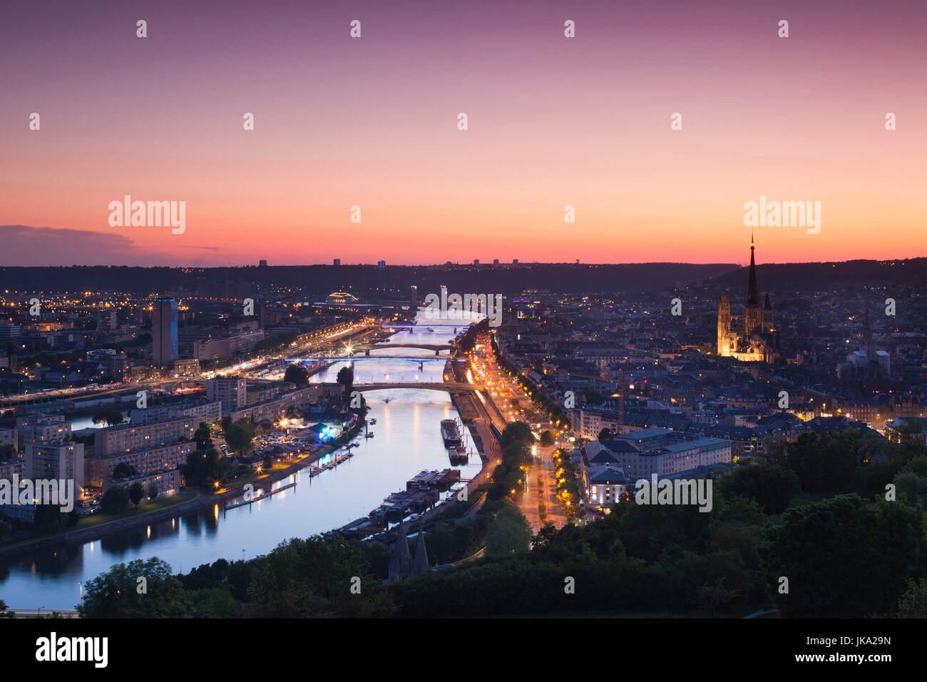 France, Normandy Region, Seine-Maritime Department, Rouen, elevated city view with Cathedral and Seine River, dusk Stock Photo