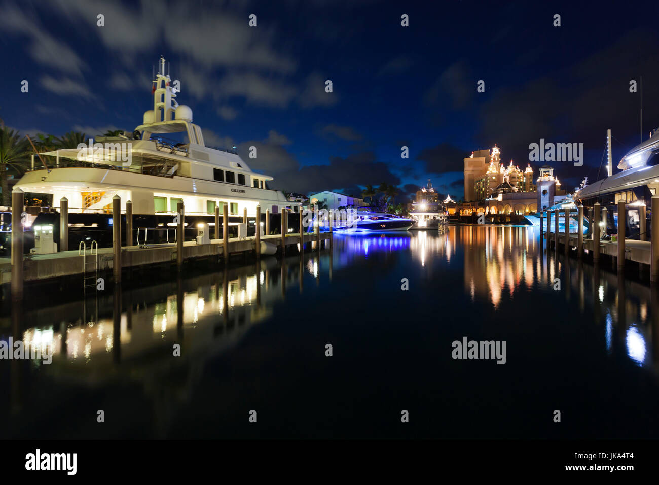 Bahamas, New Providence Island, Nassau, Paradise Island, Atlantis Hotel and Casino, Marina Village, yacht, dusk Stock Photo