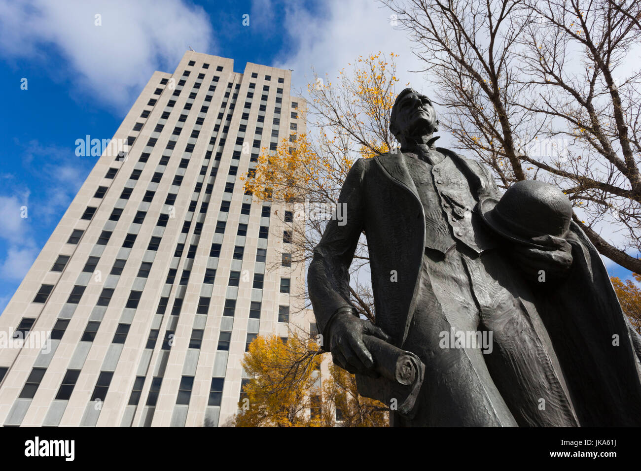 USA, North Dakota, Bismarck, North Dakota State Capitol, exterior with statue of John Burke, former governor, state supreme court justice and Treasurer of the United States Stock Photo