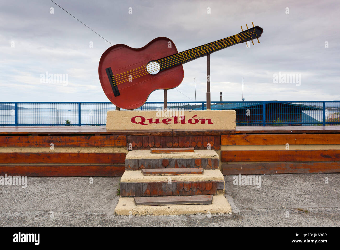 Chile, Chiloe Island, Quellon, town sign with guitar Stock Photo - Alamy