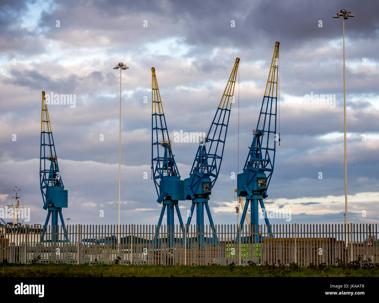 Blue Dock Cranes with Dramatic sky. Stock Photo
