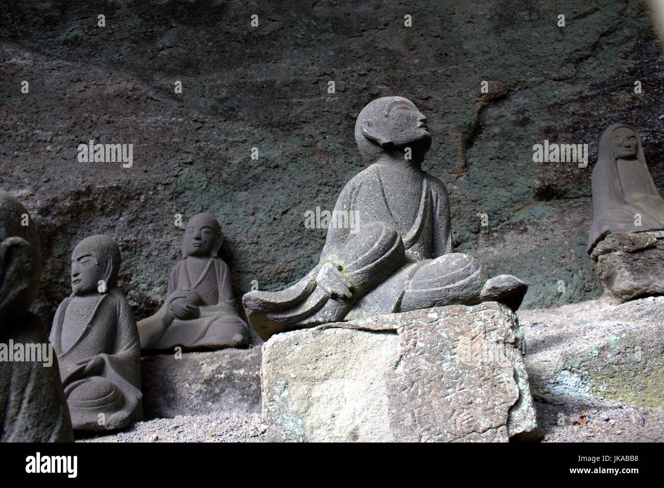 A bodhisattva statue stands on the side of Mt. Nokogiri, a sacred