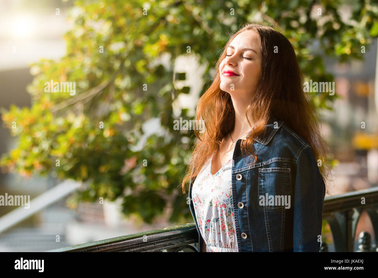 Portrait of the beautiful fashionable girl on embankment in summer day Stock Photo