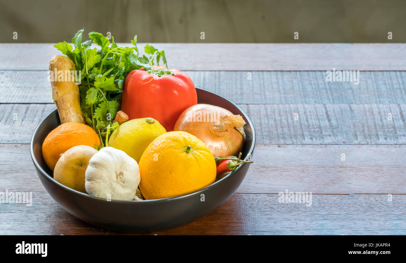 Fresh vegetables in a tray, Courgettes, onion, orange, lemon, tomato, potato Stock Photo