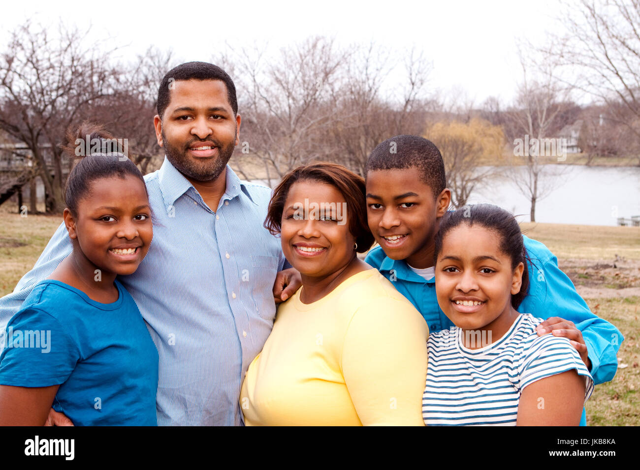 Happy African American Family Smiling Outside Stock Photo - Alamy