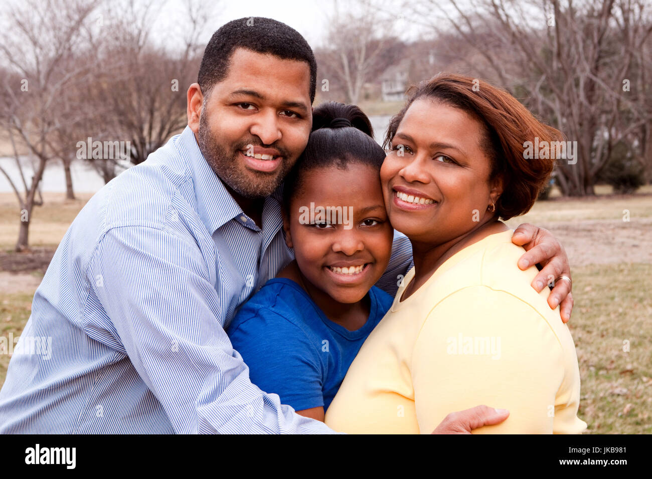 Happy African American Family Smiling Outside Stock Photo - Alamy
