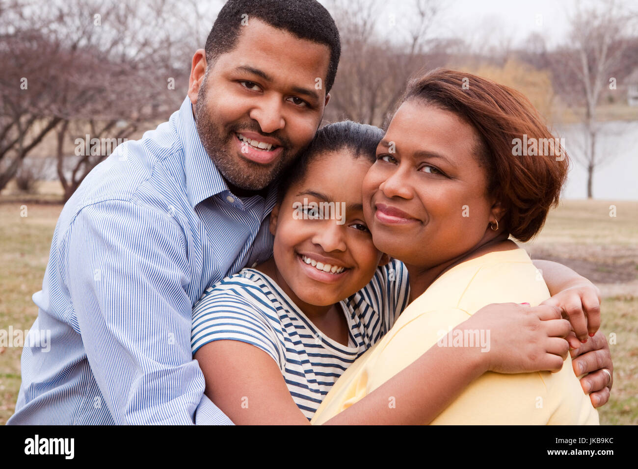 Happy African American Family Smiling Outside Stock Photo - Alamy