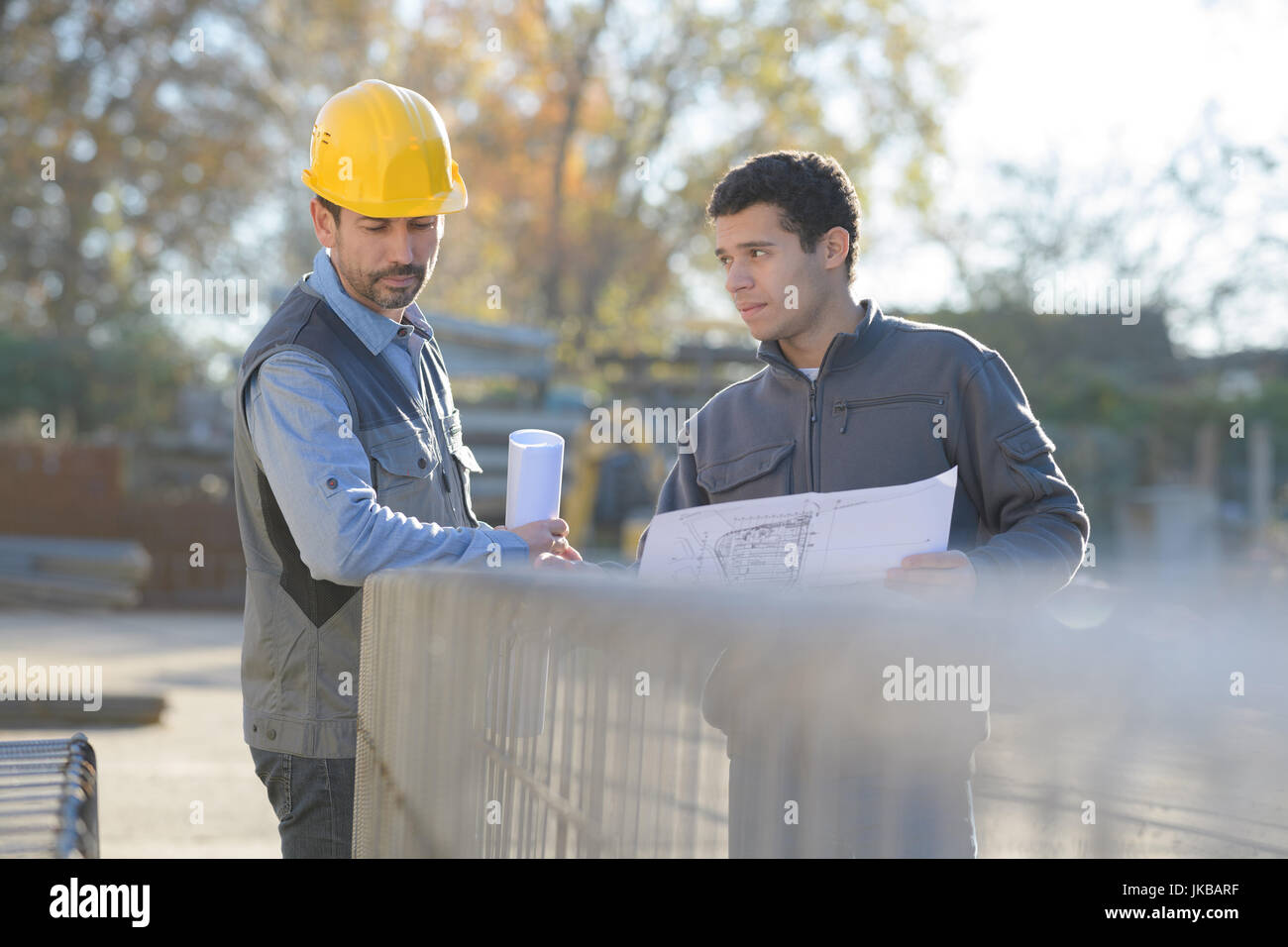 mechanic workers on a work platform in a warehouse Stock Photo Alamy