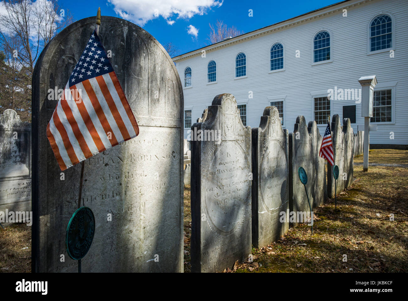 USA, Bennington, Old First Church Burying Ground, gravestones with US Flag Stock Photo