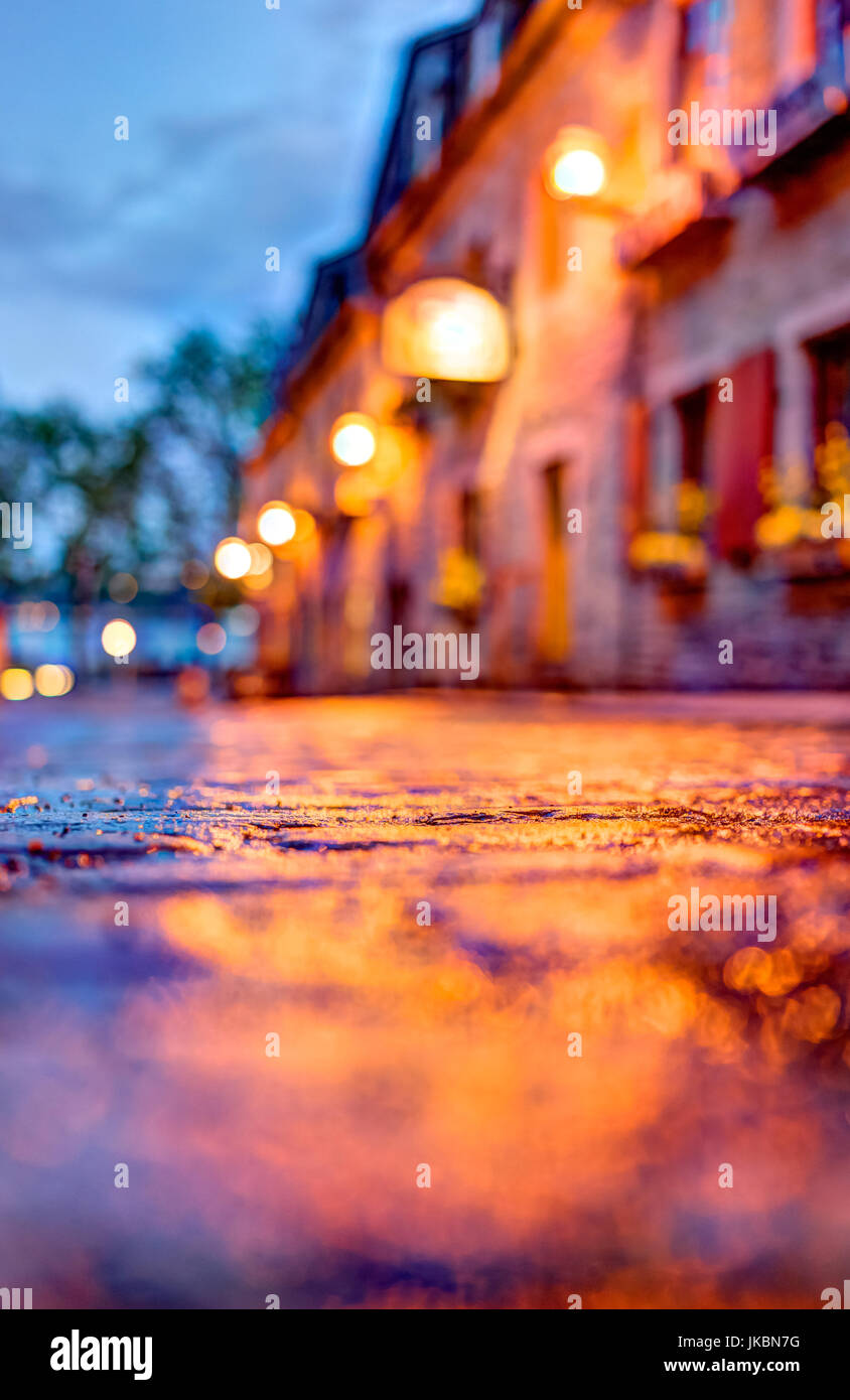 Macro closeup of colorful, vibrant and cobblestone street at night ...