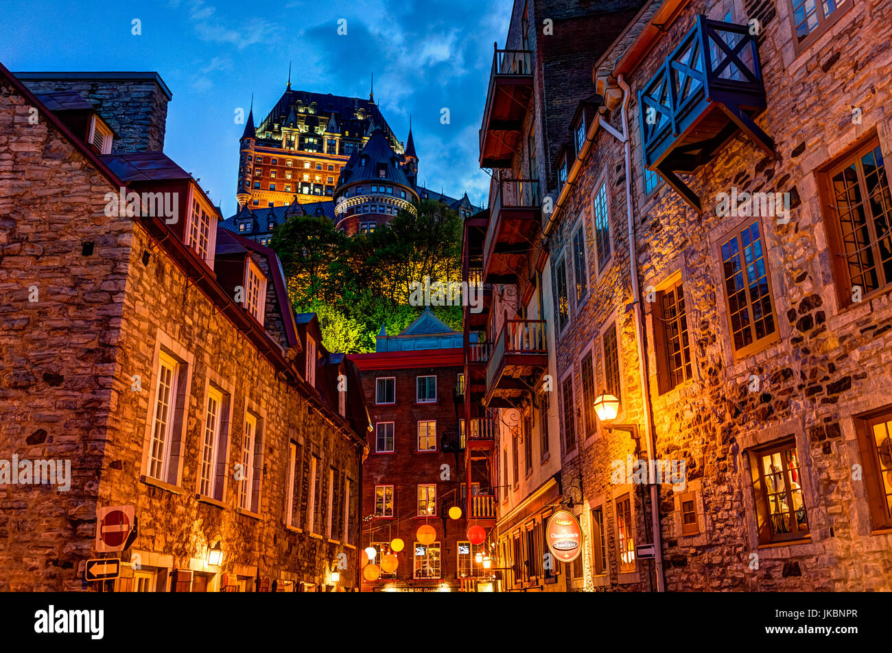 Quebec City, Canada - May 31, 2017: Lower old town cobblestone street called Sous le Fort with restaurants and Boutique La Chasse-galerie at night Stock Photo