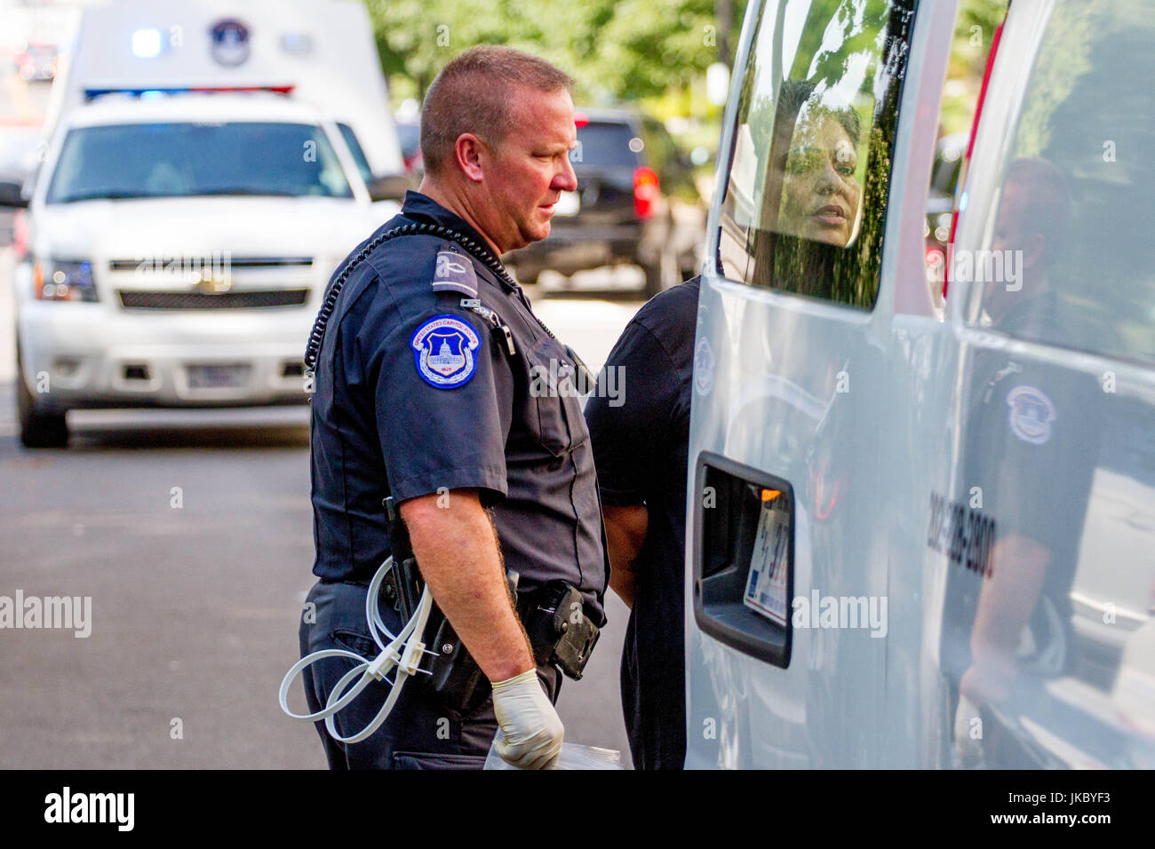 A Demonstrators is loaded into a van for transport and processing by U.S. Capitol Police following 'Kill The Bill' protests against GOP attempts to re Stock Photo