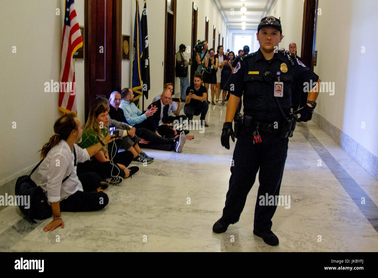 U.S. Capitol Police stand by as demonstrators stage a sit-in outside the office of Senate Majority Leader Mitch McConnell (R-KY) in Russell Senate Off Stock Photo