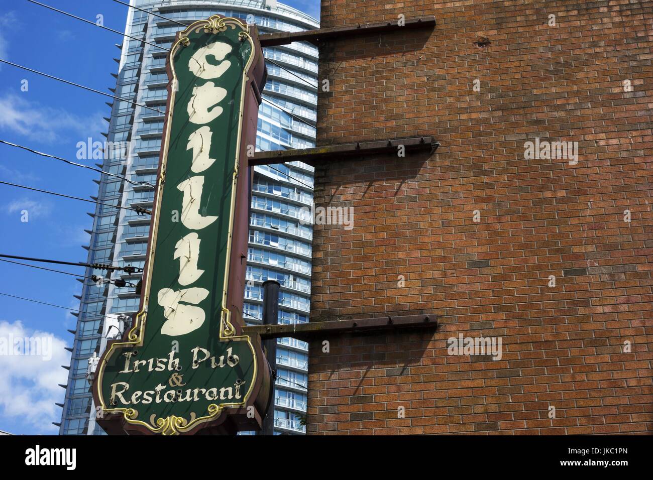 Ceilis Green Irish Restaurant and Pub Sign at Red Brick Building Wall Exterior. Granville Street Urban City Center Vancouver BC Canada Stock Photo