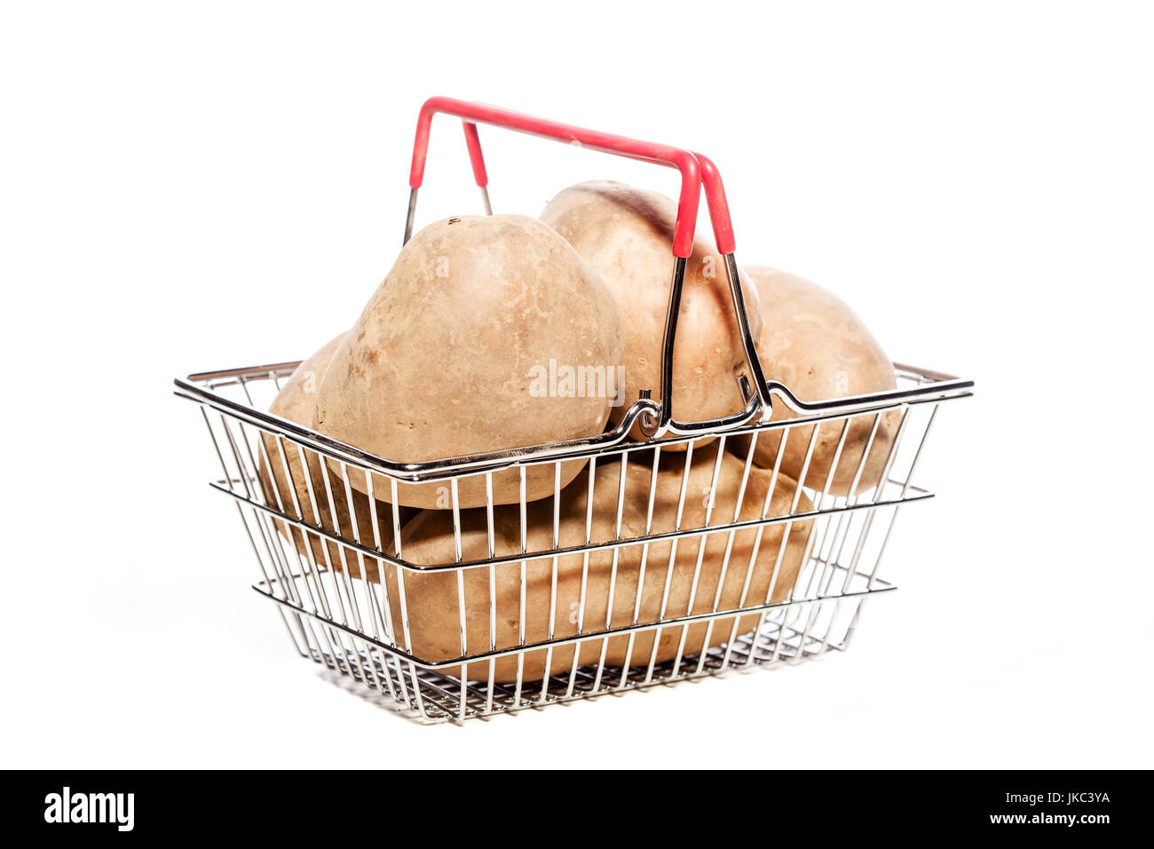 potatoes in a tiny metal shopping basket Stock Photo