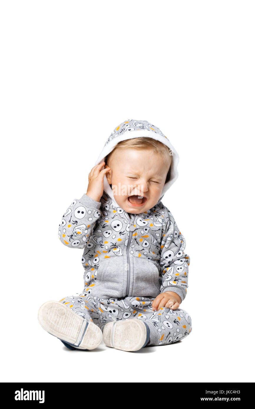 baby boy wearing a hoodie, crying, isolated on white Stock Photo