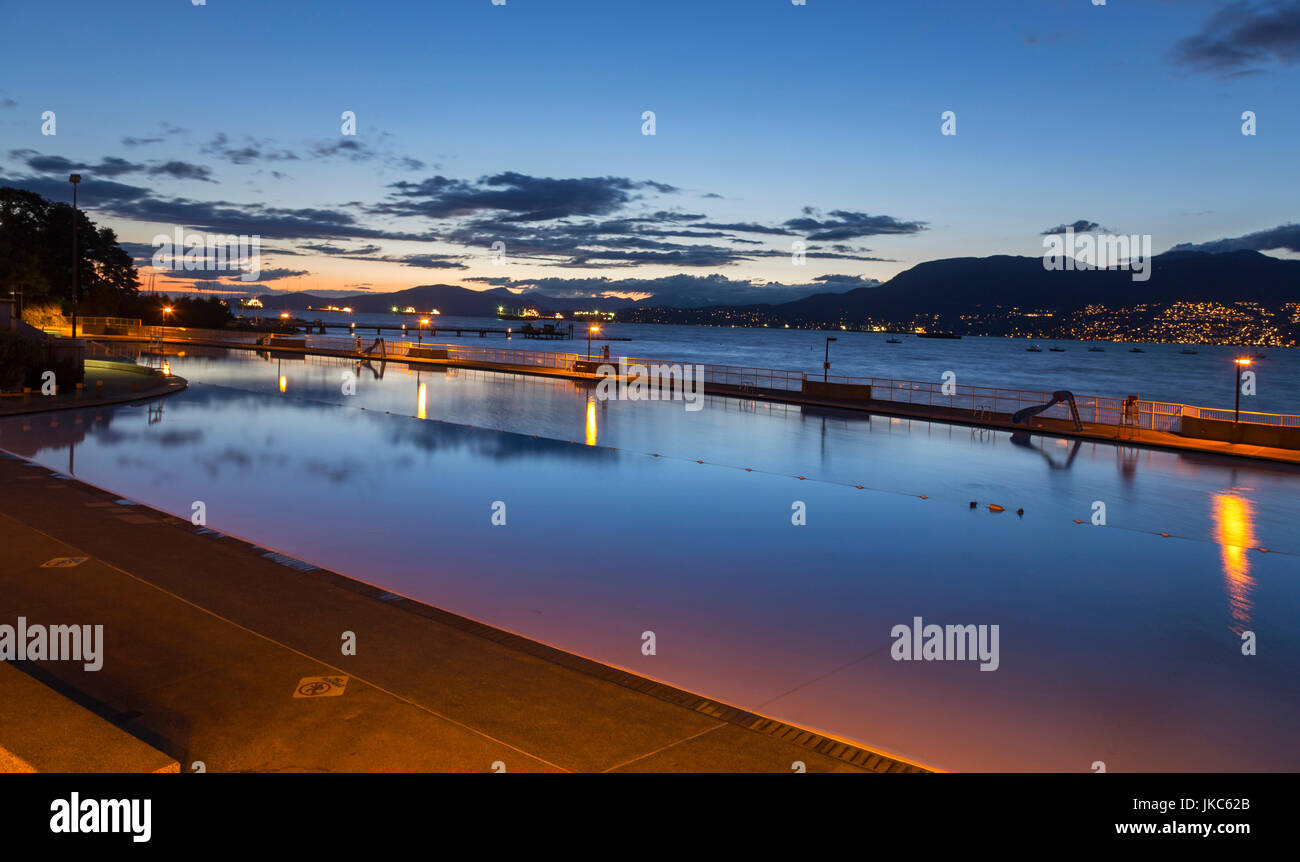 Burrard Inlet Pacific Northwest Sunset Horizon Landscape and Kits Saltwater Swimming Pool on Kits Beach, Vancouver BC Canada Stock Photo