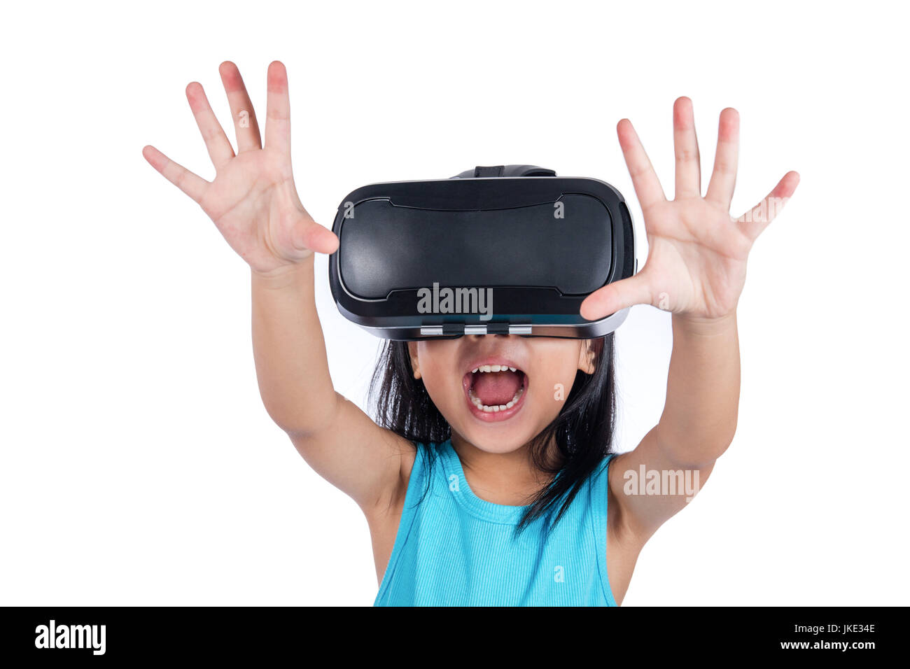 Asian little Chinese girl experiencing virtual reality via VR goggles in  isolated white background Stock Photo - Alamy