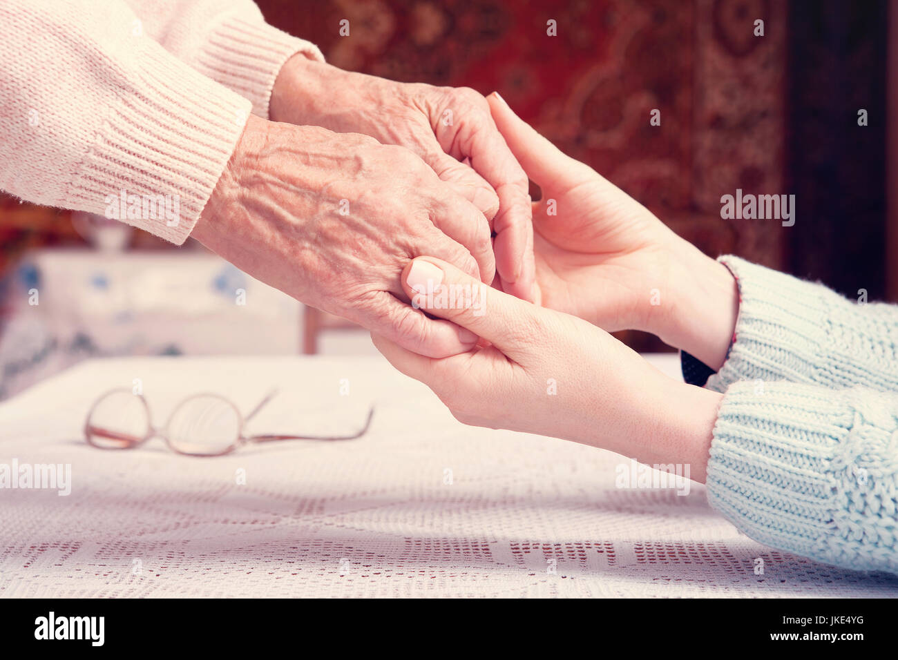 Helping hands, care for the elderly concept Stock Photo