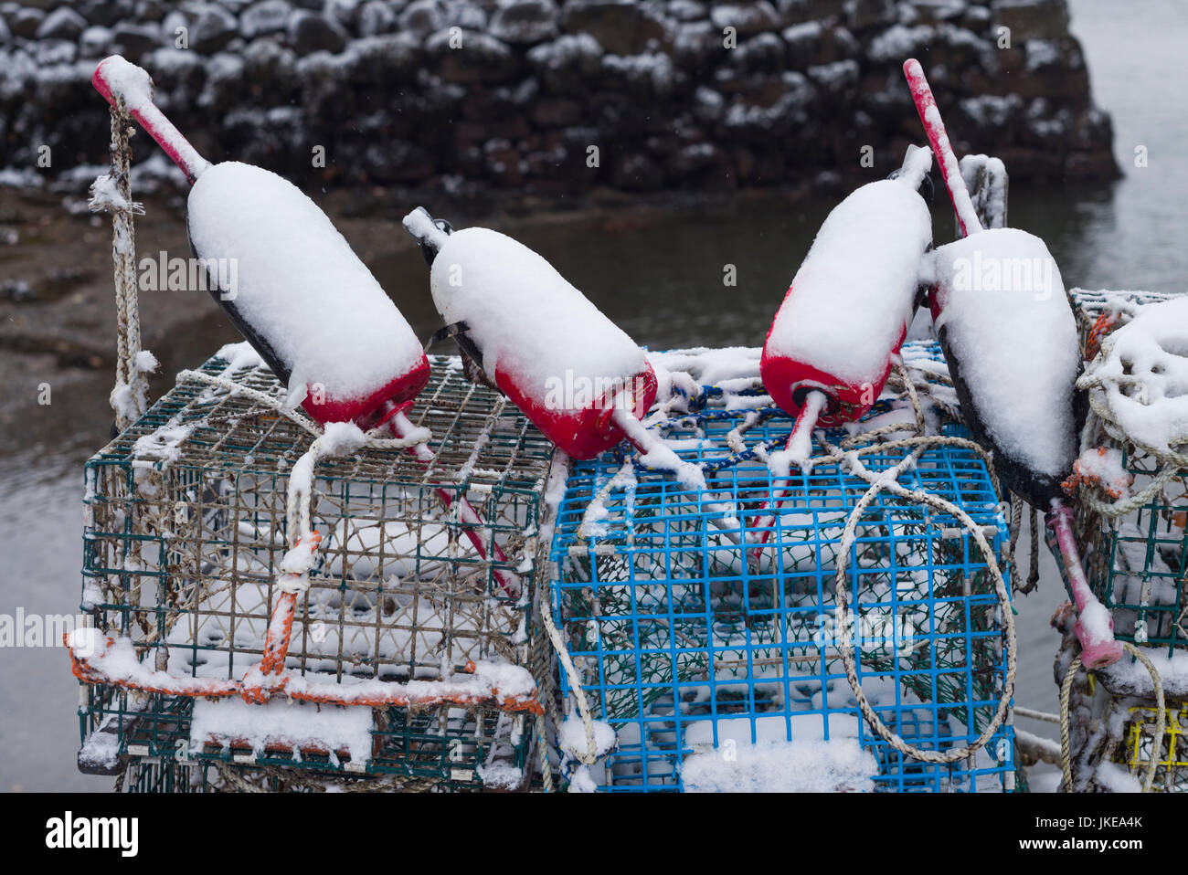 USA, Massachusetts, Cape Ann, Gloucester, early snow fall and lobster buoys on Lobster Cove Stock Photo