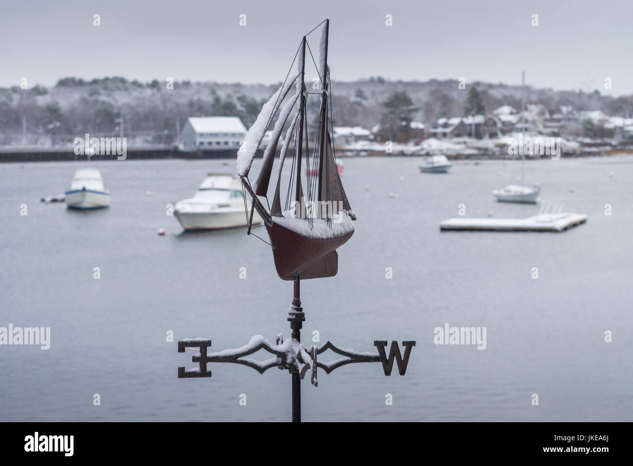 USA, Massachusetts, Cape Ann, Gloucester, early snow fall and weather vane Stock Photo